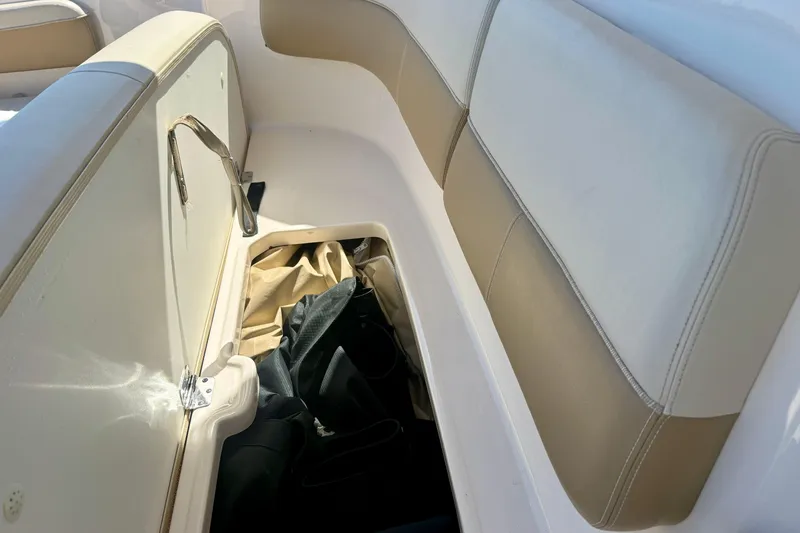 Slide: The Image of Storage compartment on a 2012 Tiara Yachts 4500 Sovran boat, with beige seating. - 68