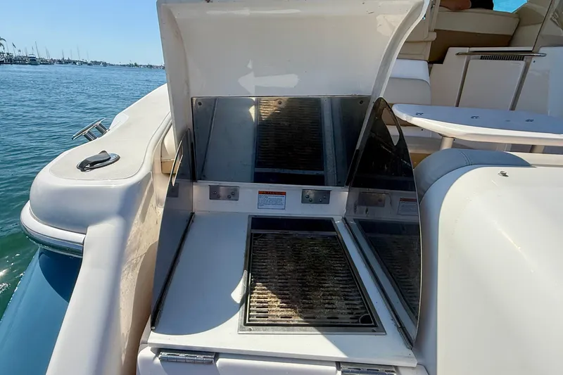 Slide: The Image of Outdoor grill on 2012 Tiara Yachts 4500 Sovran, docked by the water. - 77