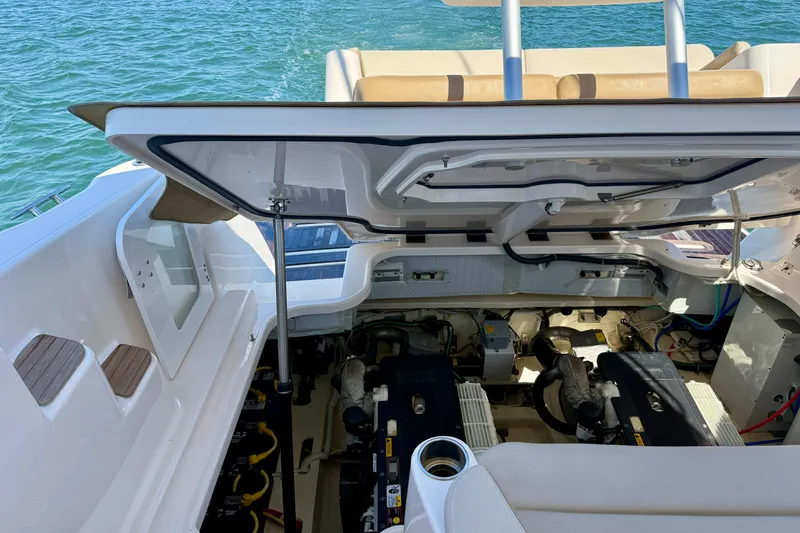 Slide: The Image of Engine compartment of 2012 Tiara Yachts 4500 Sovran, open hatch, docked on water. - 79