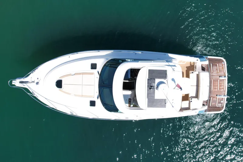 Slide: The Image of Overhead view of 2012 Tiara Yachts 4500 Sovran cruising on clear water. - 8