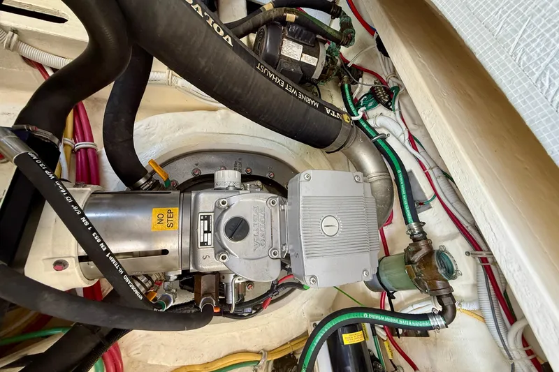 Slide: The Image of Engine compartment of 2012 Tiara Yachts 4500 Sovran, showcasing mechanical components and wiring. - 82