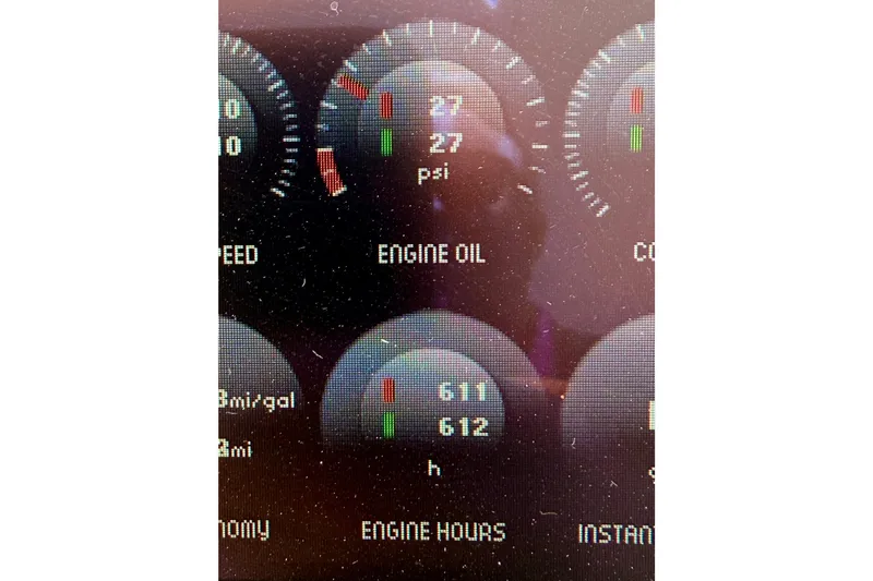 Slide: The Image of Dashboard display of a 2012 Tiara Yachts 4500 Sovran showing engine oil pressure and hours. - 86