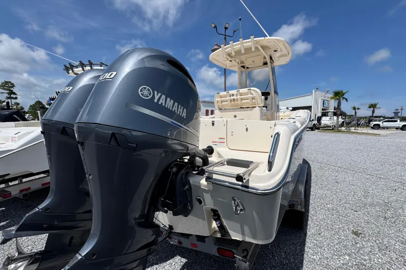 Slide: The Image of 2022 Grady-White Fisherman 257 boat with dual Yamaha engines, parked outdoors. - 11