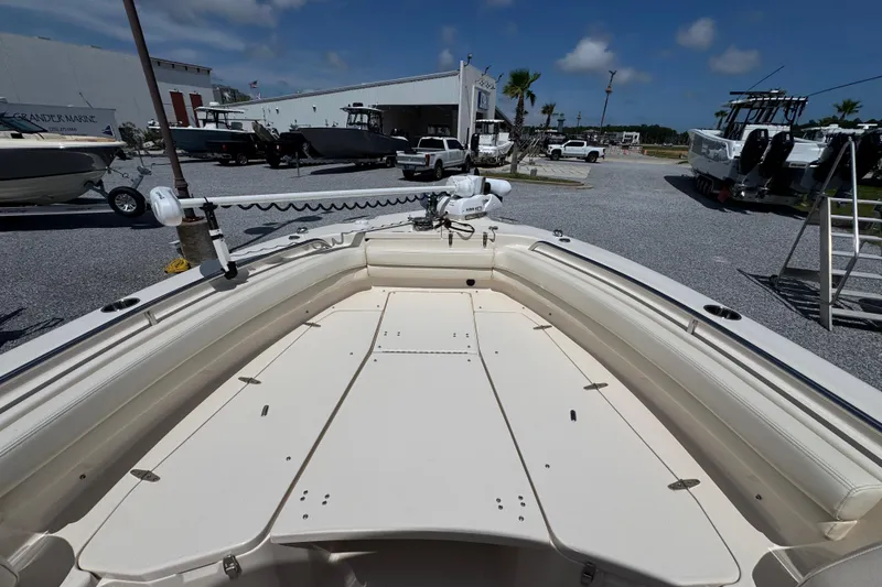 Slide: The Image of 2022 Grady-White Fisherman 257 boat displayed at a marina under a clear blue sky. - 14