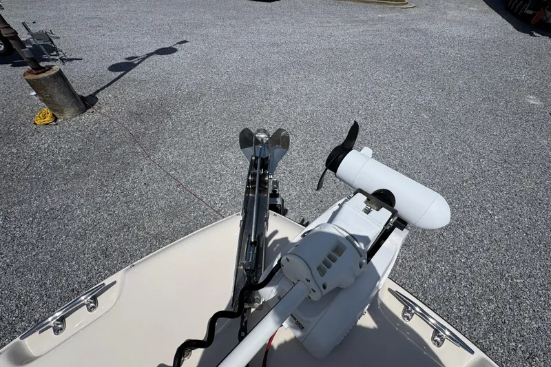 Slide: The Image of 2022 Grady-White Fisherman 257 boat with trolling motor on gravel surface. - 17