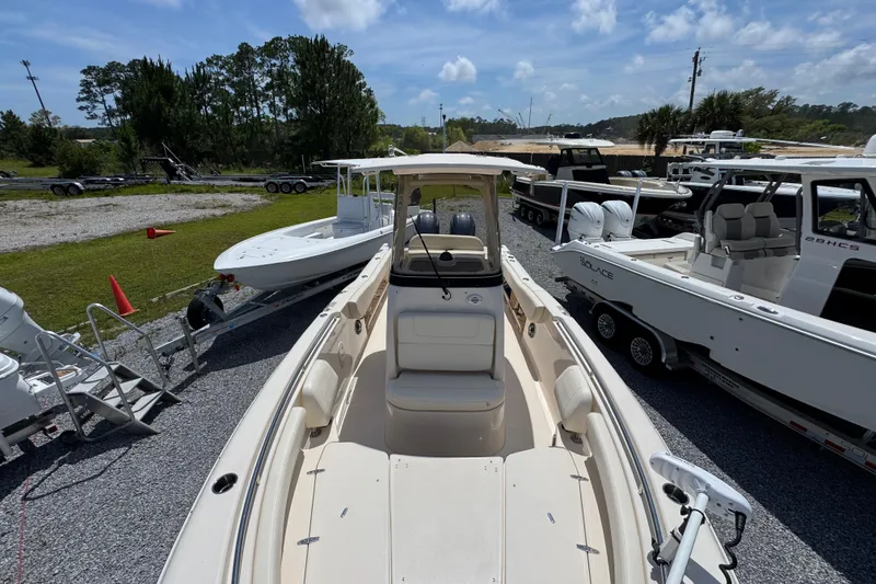 Slide: The Image of 2022 Grady-White Fisherman 257 boat displayed in a marina with other vessels. - 19