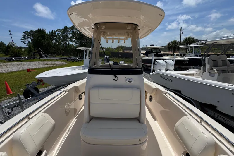 Slide: The Image of 2022 Grady-White Fisherman 257 boat interior with seating and console, parked outdoors. - 20