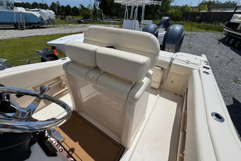 Slide: The Image of 2022 Grady-White Fisherman 257 boat interior with steering wheel and seating. - 23
