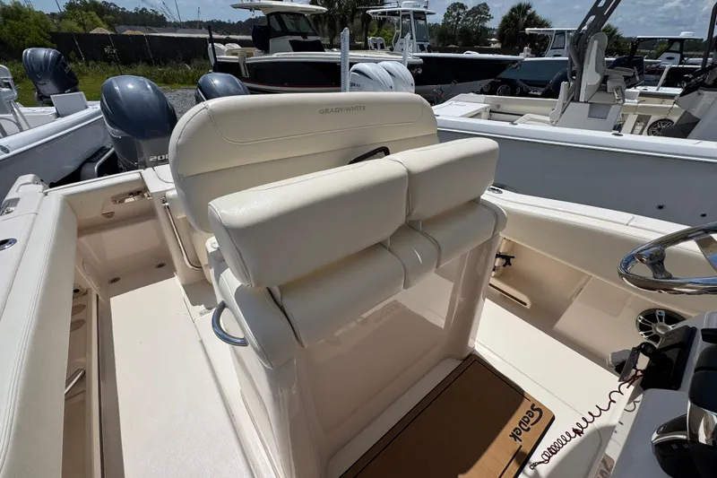 Slide: The Image of 2022 Grady-White Fisherman 257 boat interior with dual engines and steering console. - 25