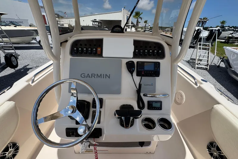 Slide: The Image of 2022 Grady-White Fisherman 257 boat console with Garmin navigation system and steering wheel. - 27