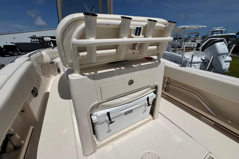 Slide: The Image of 2022 Grady-White Fisherman 257 boat interior with rod holders and Yeti cooler. - 30