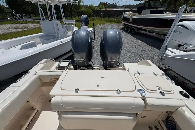 Slide: The Image of 2022 Grady-White Fisherman 257 boat with dual 200 horsepower engines, parked outdoors. - 33