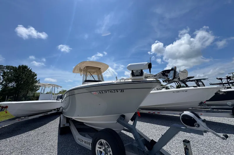 Slide: The Image of 2022 Grady-White Fisherman 257 boat on trailer under clear blue sky. - 4