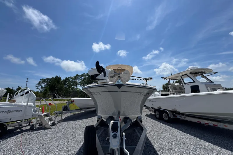Slide: The Image of 2022 Grady-White Fisherman 257 boat on trailer under clear blue sky. - 5