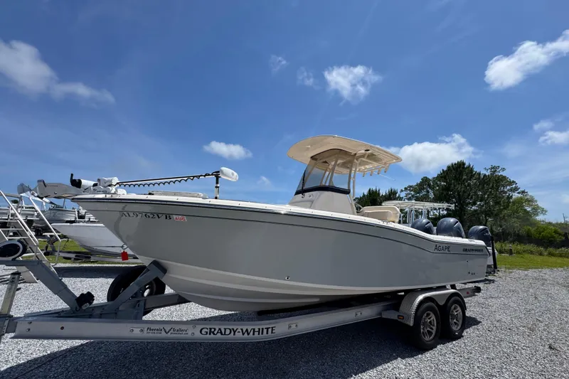Slide: The Image of 2022 Grady-White Fisherman 257 boat on trailer under clear blue sky. - 7