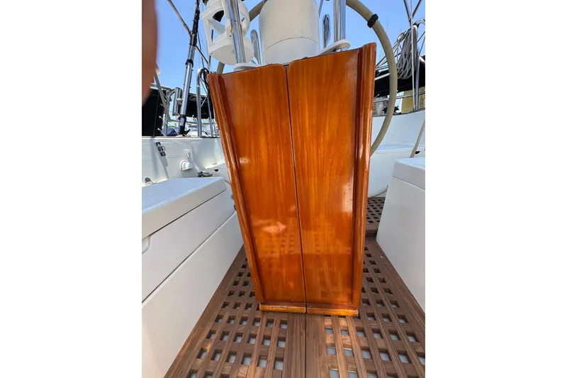 Slide: The Image of Polished wooden panel on 1989 Gulf Pilot House boat deck. - 18