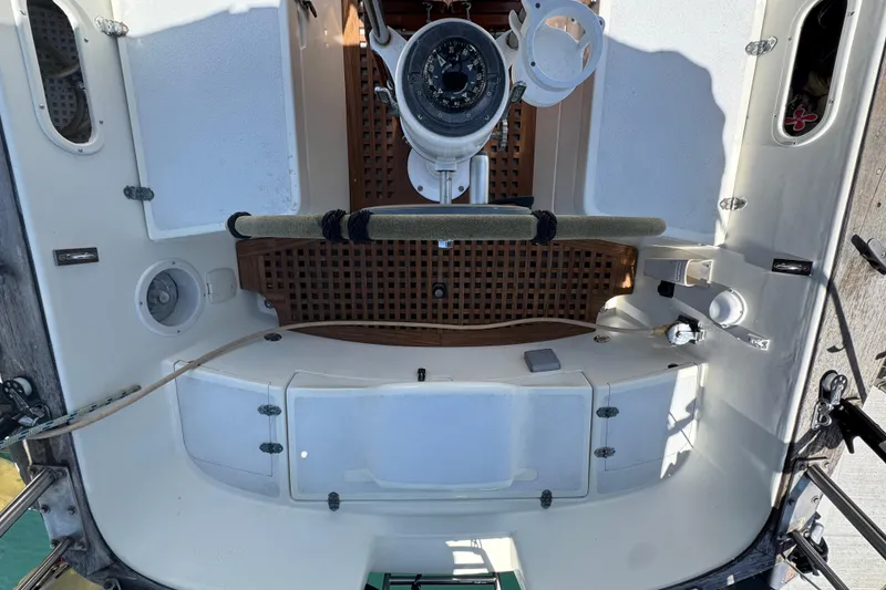 Slide: The Image of Cockpit of a 1989 Gulf Pilot House boat with steering wheel and navigation instruments. - 20