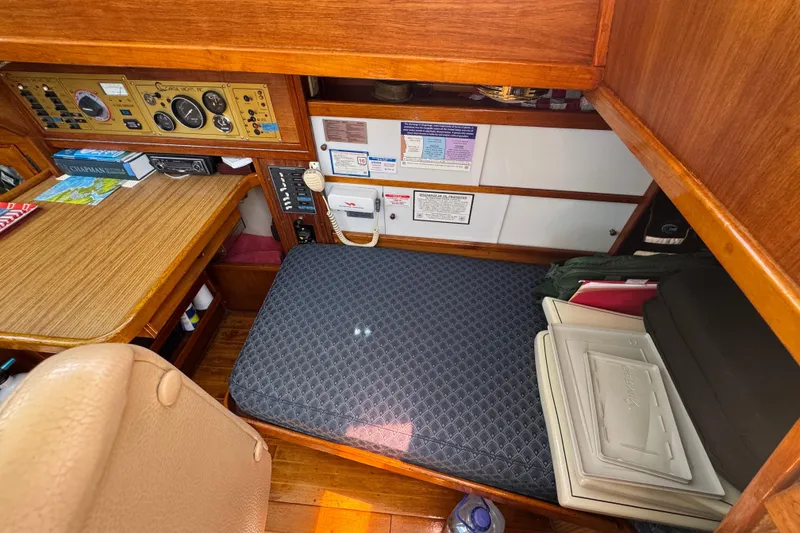 Slide: The Image of 1989 Gulf Pilot House interior with navigation station and cushioned seating area. - 33