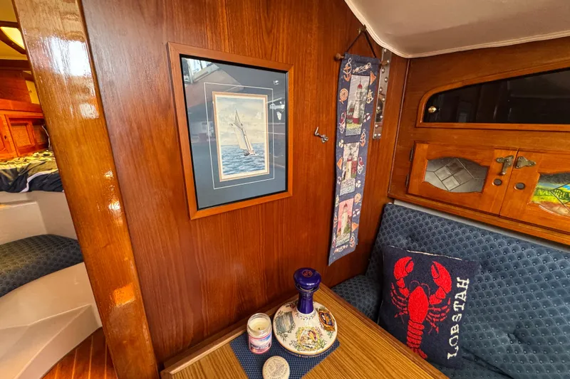 Slide: The Image of Interior of a 1989 Gulf Pilot House with nautical decor and wooden finishes. - 47
