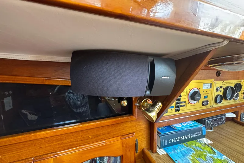 Slide: The Image of 1989 Gulf Pilot House interior with Bose speaker and navigation instruments. - 49