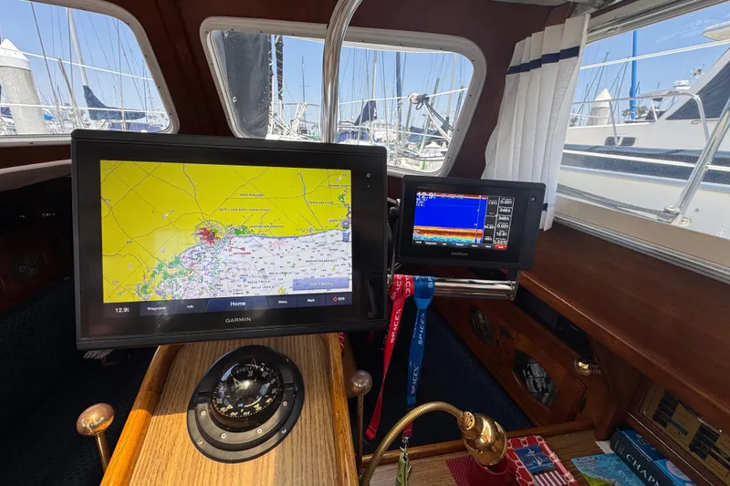 Slide: The Image of Interior of a 1989 Gulf Pilot House with navigation screens and compass. - 61