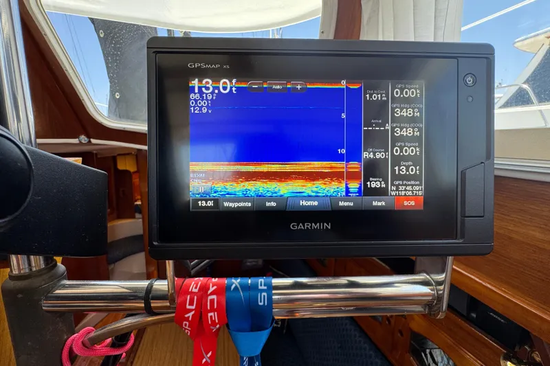Slide: The Image of Garmin GPS display on 1989 Gulf Pilot House boat, showing navigation and depth data. - 62