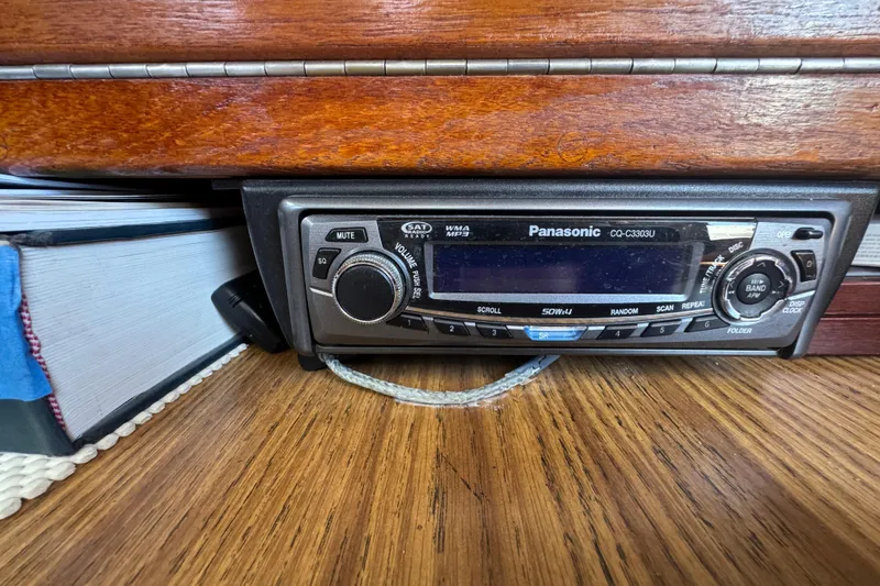Slide: The Image of Panasonic car stereo in 1989 Gulf Pilot House, wooden dashboard background. - 66