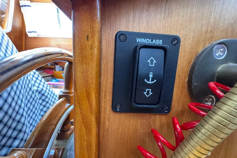 Slide: The Image of Windlass control switch on 1989 Gulf Pilot House boat dashboard. - 70