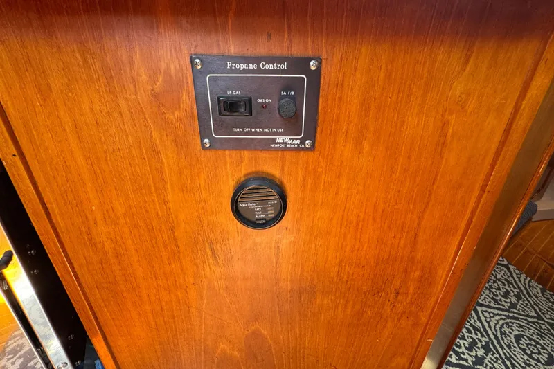 Slide: The Image of Propane control panel on 1989 Gulf Pilot House wooden interior. - 73