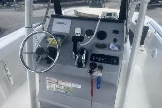 Slide: The Image of 2023 Trophy T22 boat console with steering wheel and control panel. - 10