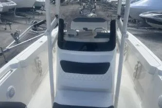 Slide: The Image of 2023 Trophy T22 boat interior with seating and steering console. - 12