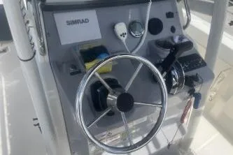Slide: The Image of Steering console of 2023 Trophy T22 boat with Simrad electronics. - 13