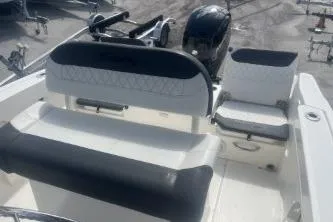 Slide: The Image of 2023 Trophy T22 boat interior with seating and steering console. - 14