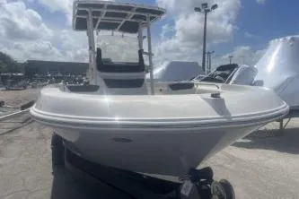 Slide: The Image of 2023 Trophy T22 boat on trailer under a cloudy sky. - 3