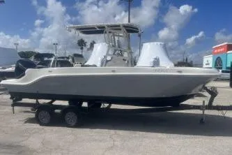 Slide: The Image of 2023 Trophy T22 boat on trailer under a partly cloudy sky. - 5