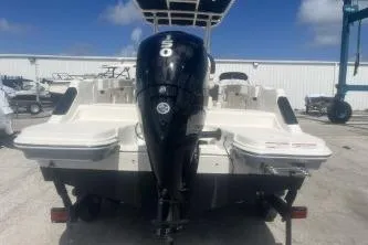 Slide: The Image of 2023 Trophy T22 boat with powerful outboard motor, parked on a trailer. - 8