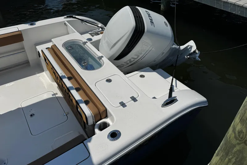 Slide: The Image of 2024 Sea Pro 239 Deep V CC boat with Suzuki outboard engine at dock. - 52
