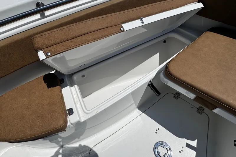 Slide: The Image of 2024 Sea Pro 239 Deep V CC boat interior with brown cushioned seating. - 60