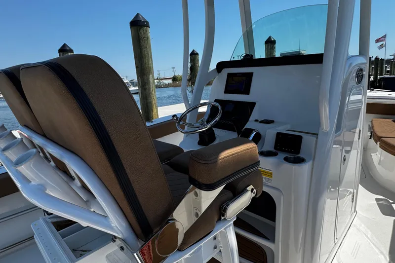 Slide: The Image of 2024 Sea Pro 239 Deep V CC boat interior with helm and seating. - 62