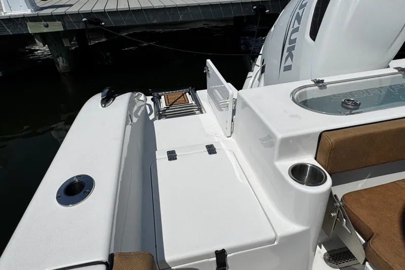 Slide: The Image of 2024 Sea Pro 239 Deep V CC boat interior with seating and storage compartments. - 67