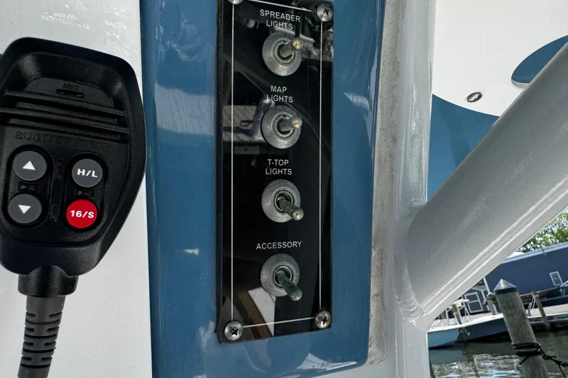 Slide: The Image of Control panel and microphone on 2024 Sea Pro 239 Deep V CC boat. - 84