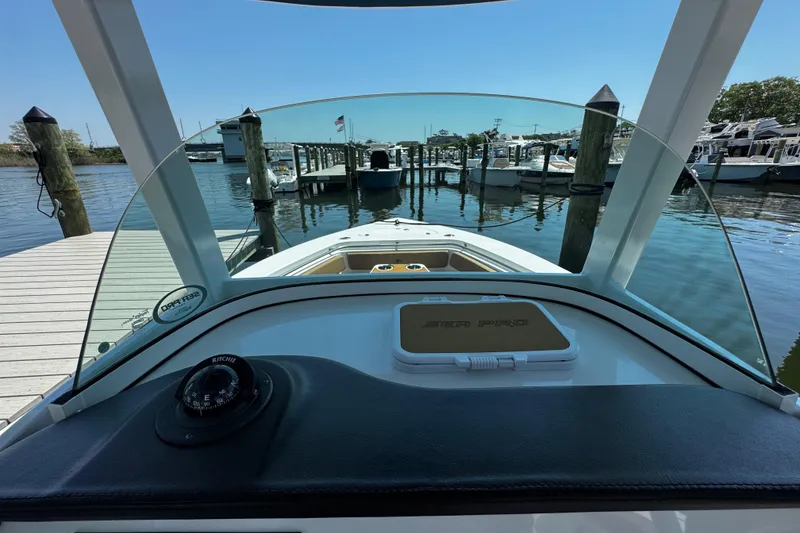 Slide: The Image of 2024 Sea Pro 239 Deep V CC boat docked at marina, view from helm. - 89