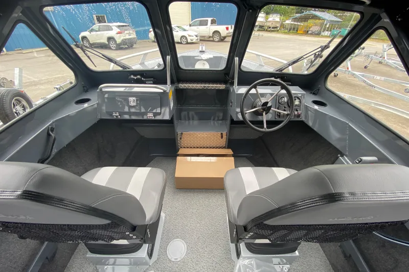 Slide: The Image of Interior of 2026 Hewescraft 160 Sportsman boat with dual seats and steering wheel. - 12