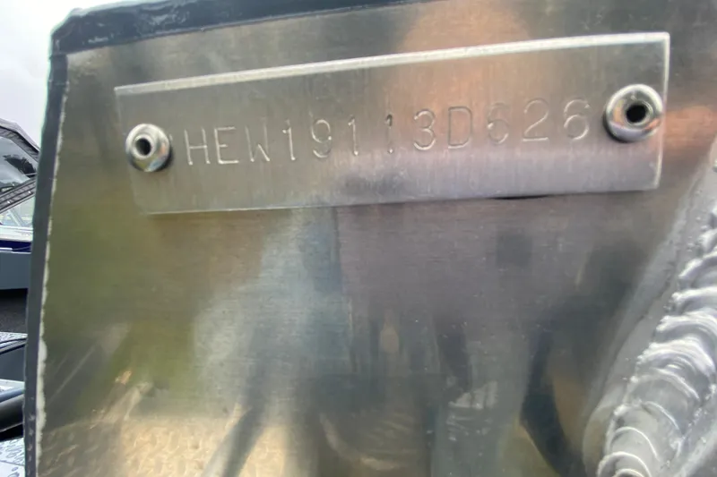 Slide: The Image of HIN plate on 2026 Hewescraft 160 Sportsman boat, displaying serial number. - 5