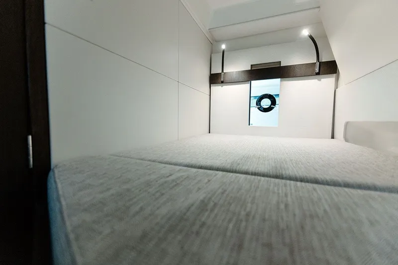 Slide: The Image of Interior of a modern cabin with a large bed and a porthole. - 20