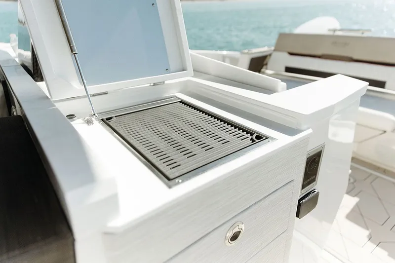 Slide: The Image of A modern grill on a boat with a view of the sea in the background. - 11