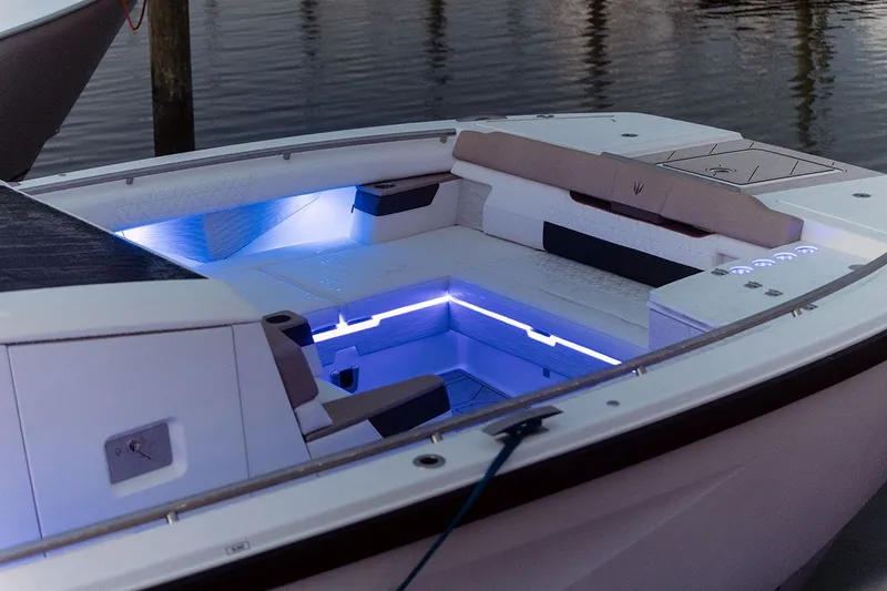 Slide: The Image of The image shows the cockpit of a 2027 Ducari 37 XIV boat with blue LED lighting. - 16