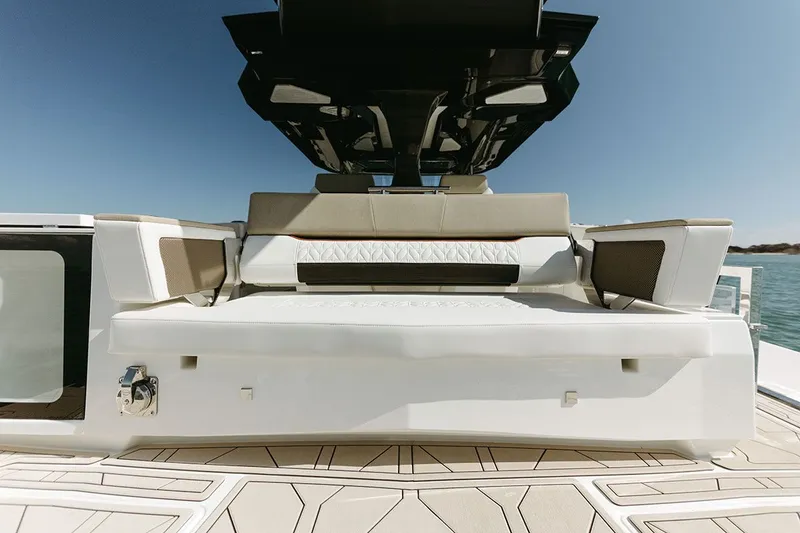 Slide: The Image of The image shows the stern of a 2027 Ducari 37 XIV boat with sleek seating. - 6