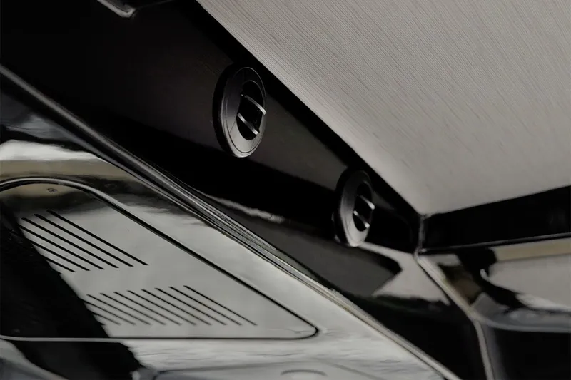 Slide: The Image of Close-up of a modern boat interior with sleek black surfaces and ventilation openings. - 22