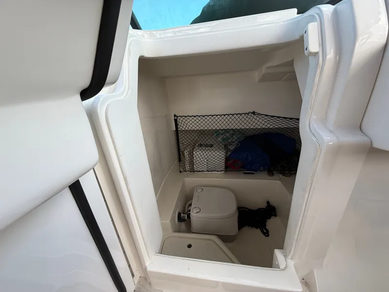 Slide: The Image of Interior view of 2023 Sea Ray SDX 250 Outboard at marina. - 16